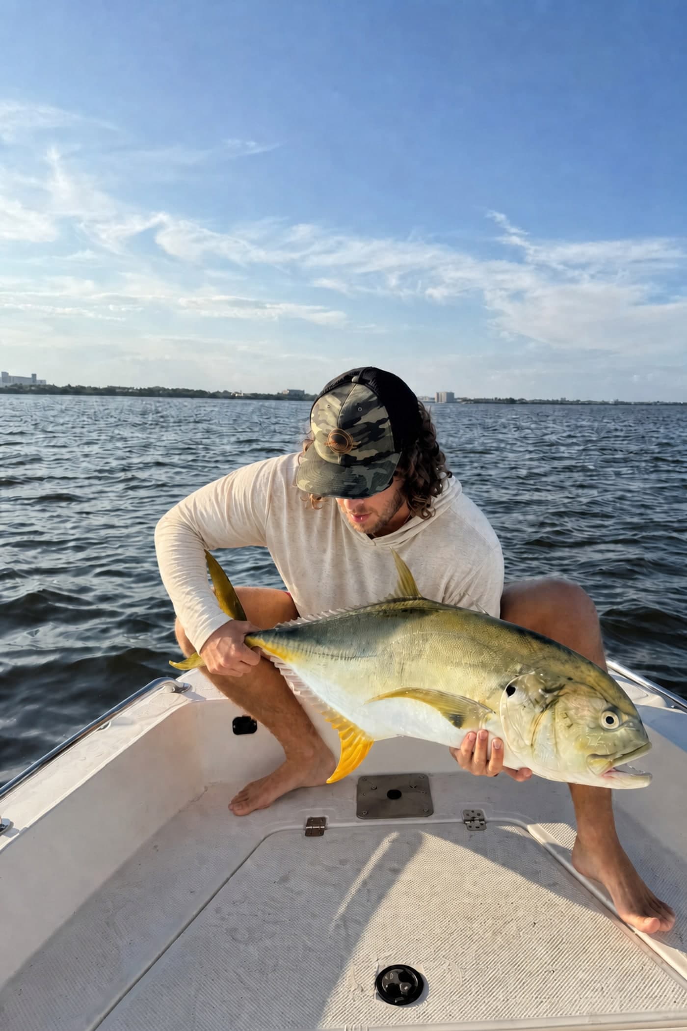 Inshore fishing in the Twin Fin sun hoodie with a jack crevalle